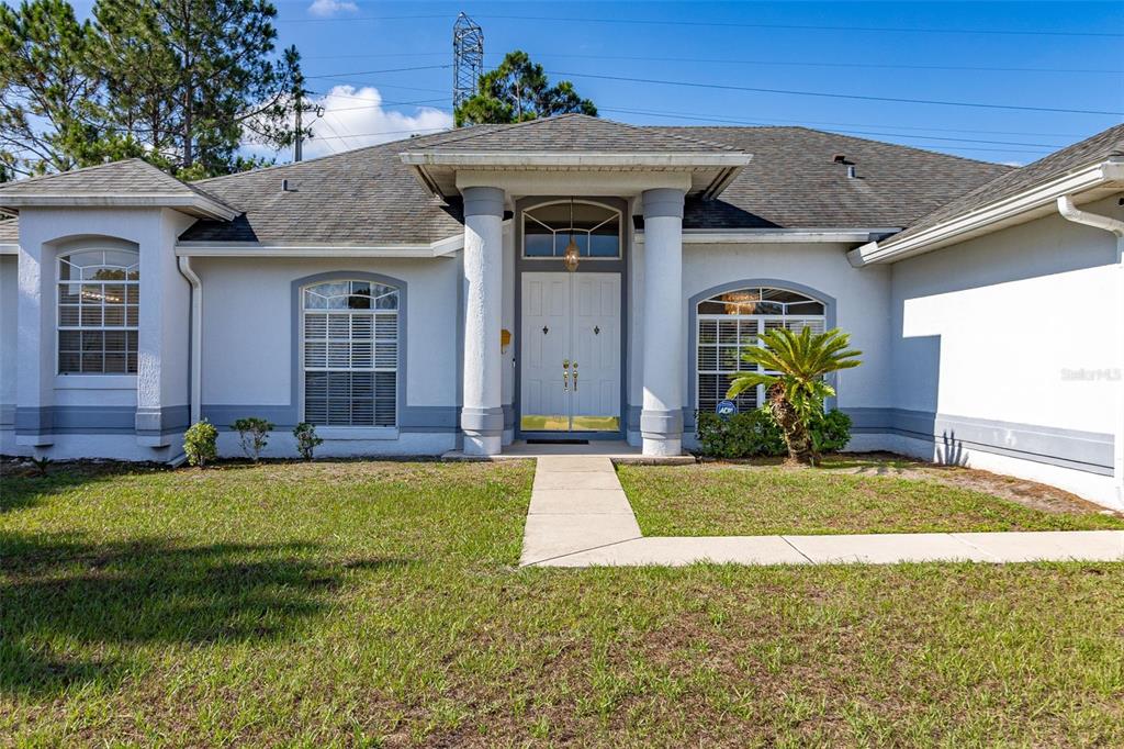 a front view of a house with a yard