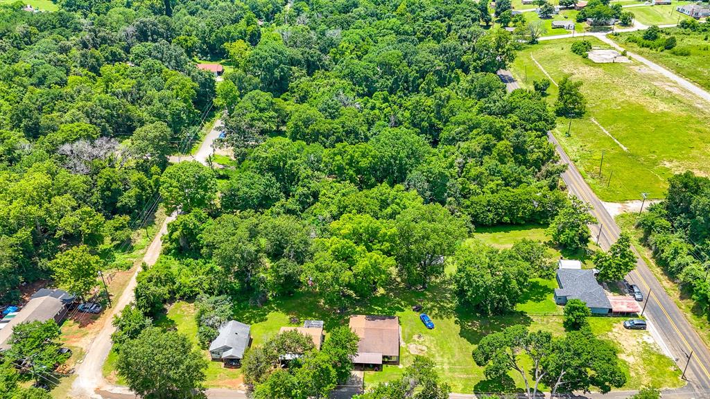 an aerial view of a garden with houses