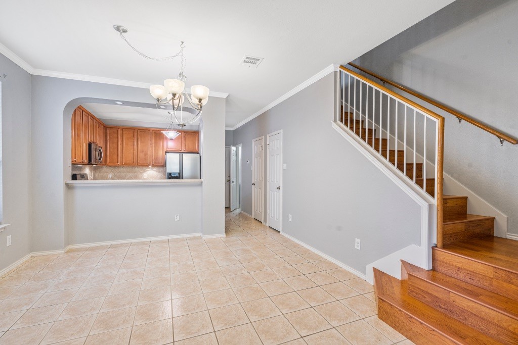 a view of a room with wooden floor and staircase