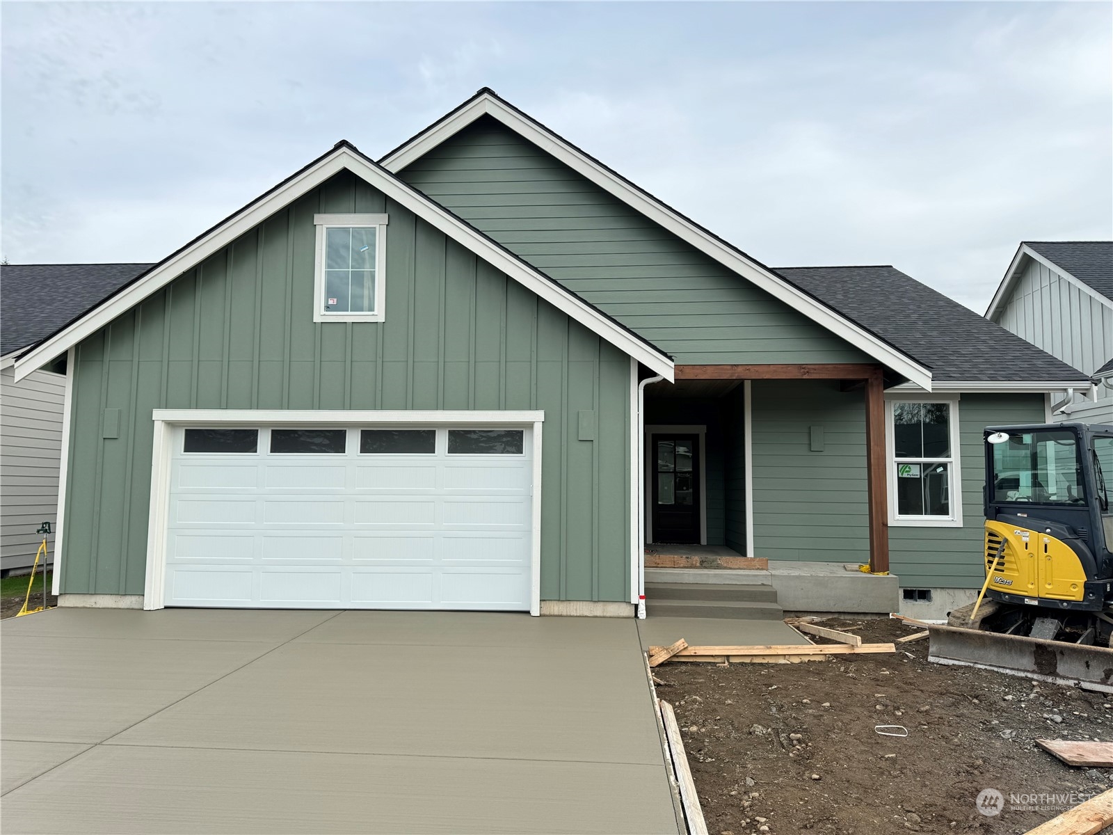 a front view of a house with a garage