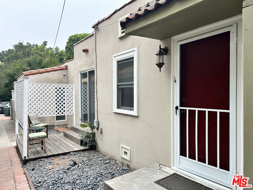 a view of balcony with wooden floor