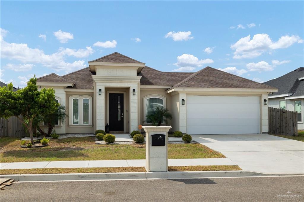 View of front of home with a garage