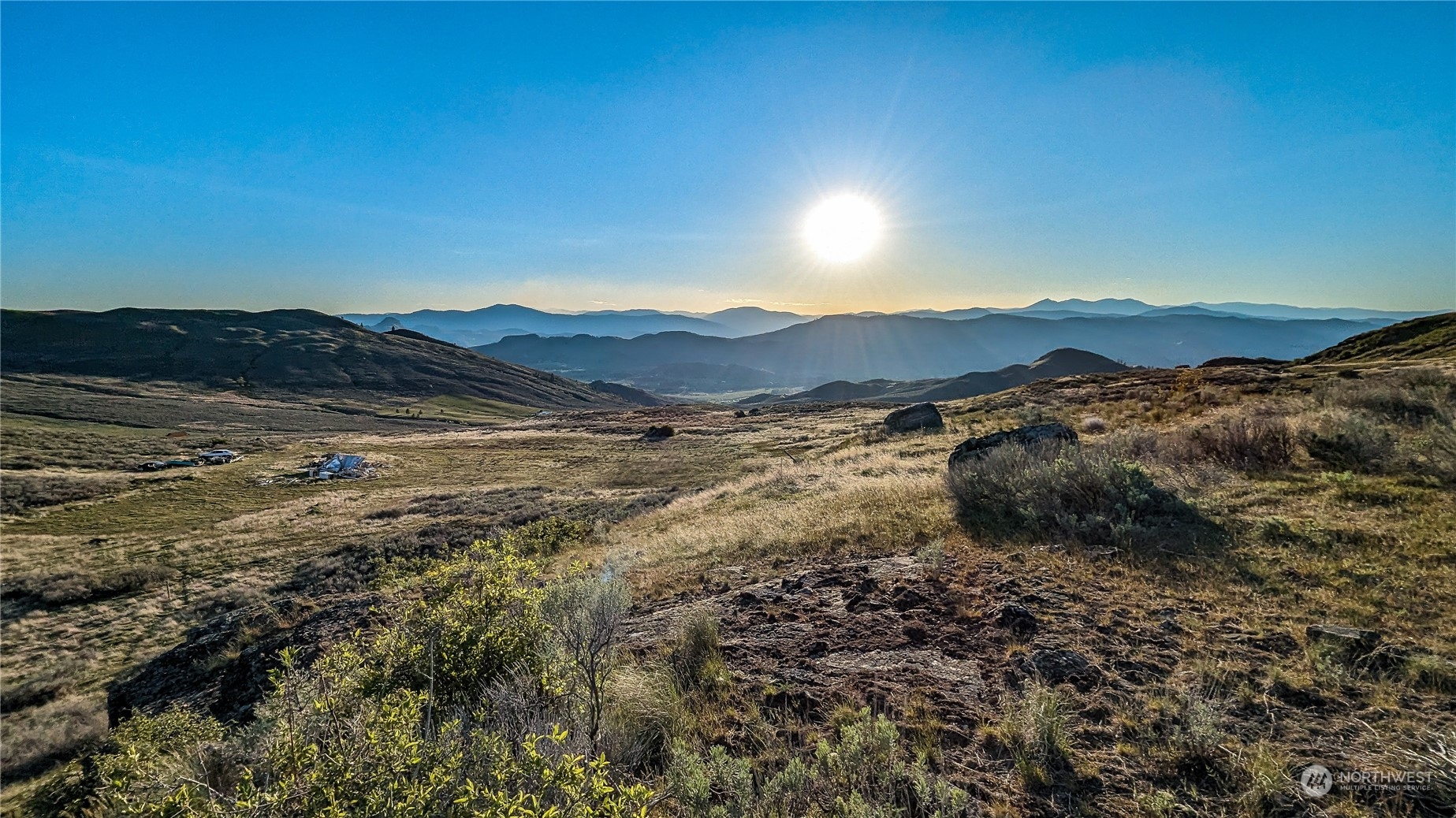 a view of mountain with sunset view