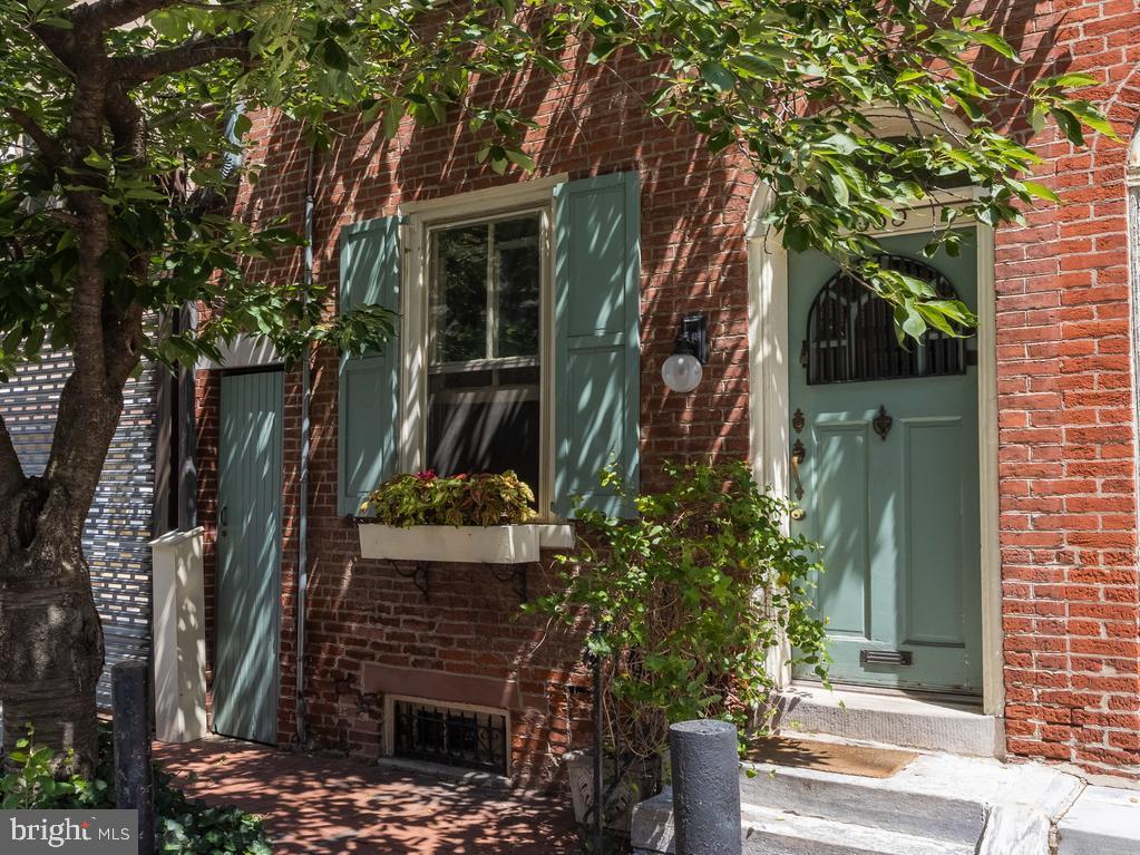 a view of a house with a tree