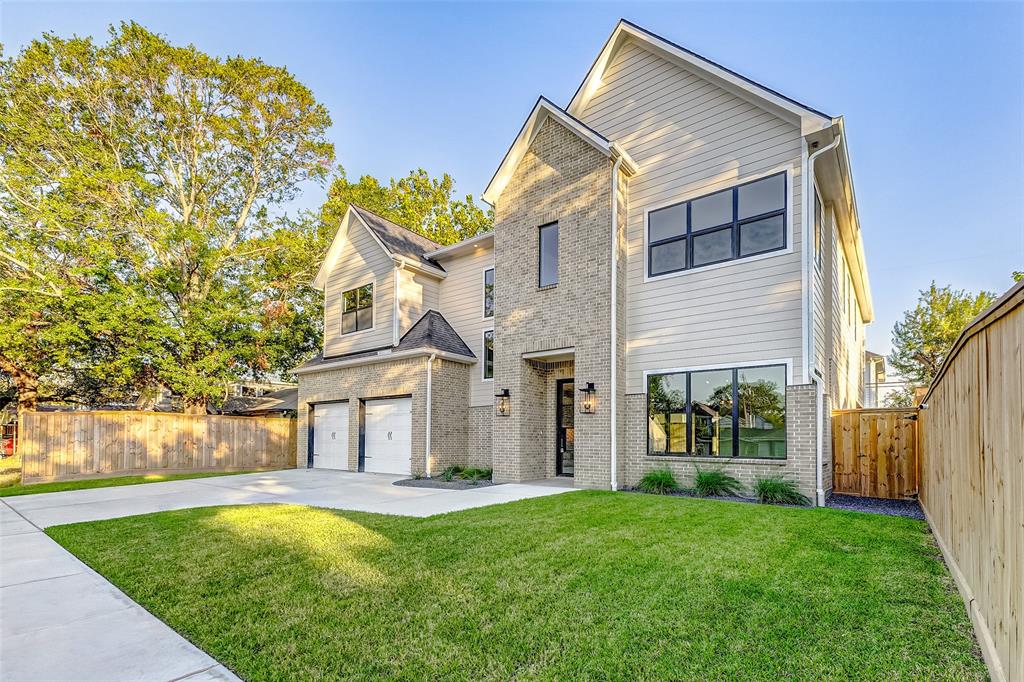 a front view of house with yard and outdoor seating