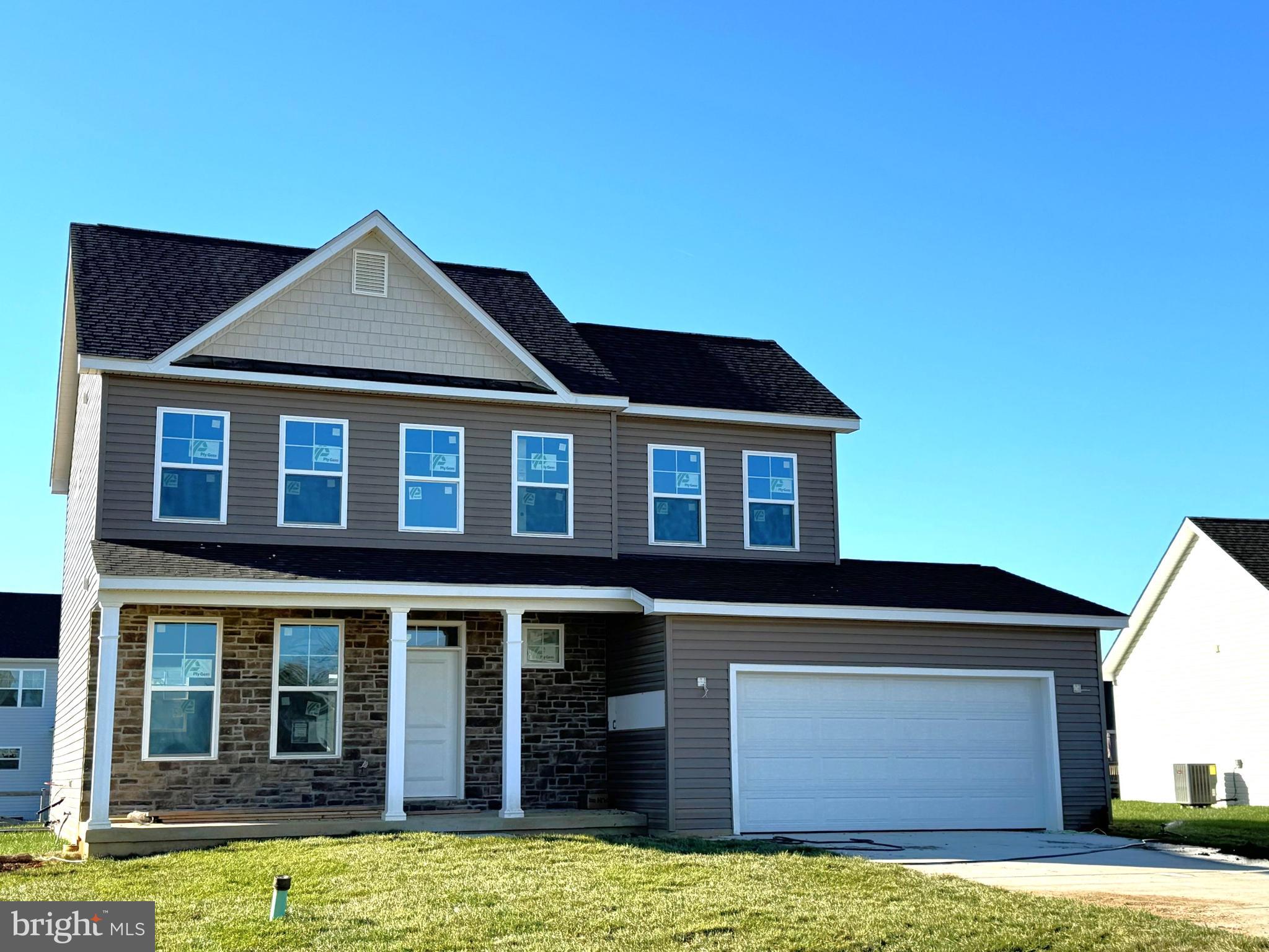 a front view of a house with yard