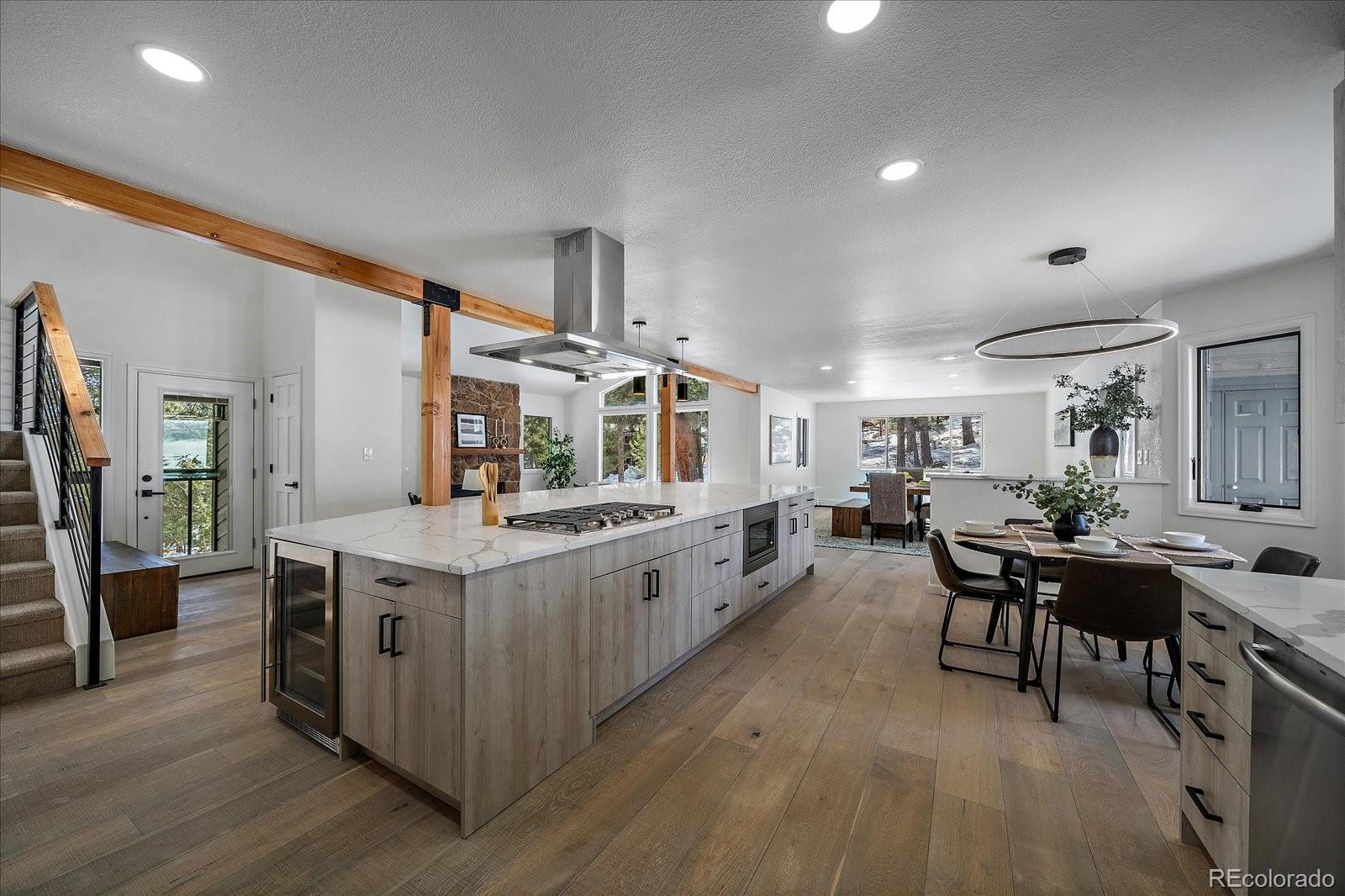 a large kitchen with lots of counter space and furniture