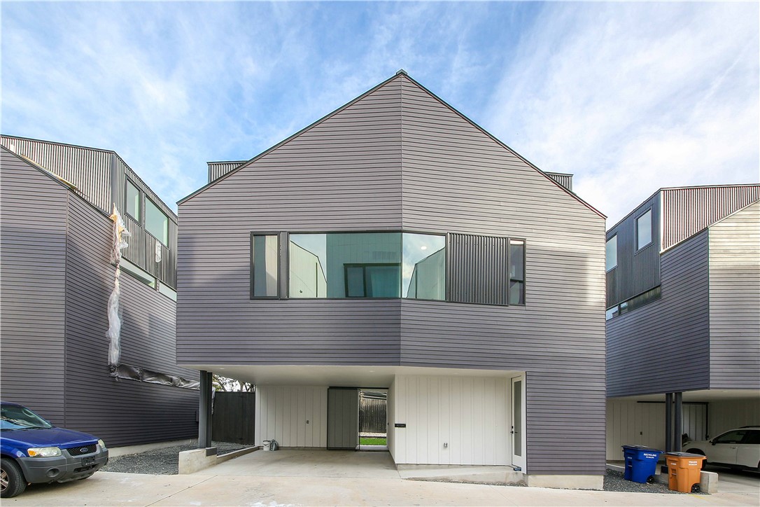 a front view of a house with parking