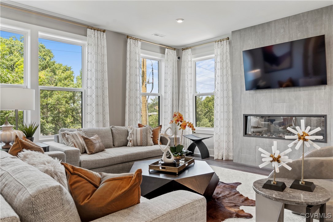 a living room with furniture and a flat screen tv