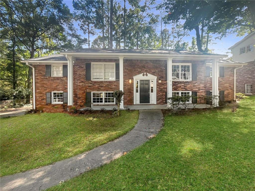 front view of a house with a yard