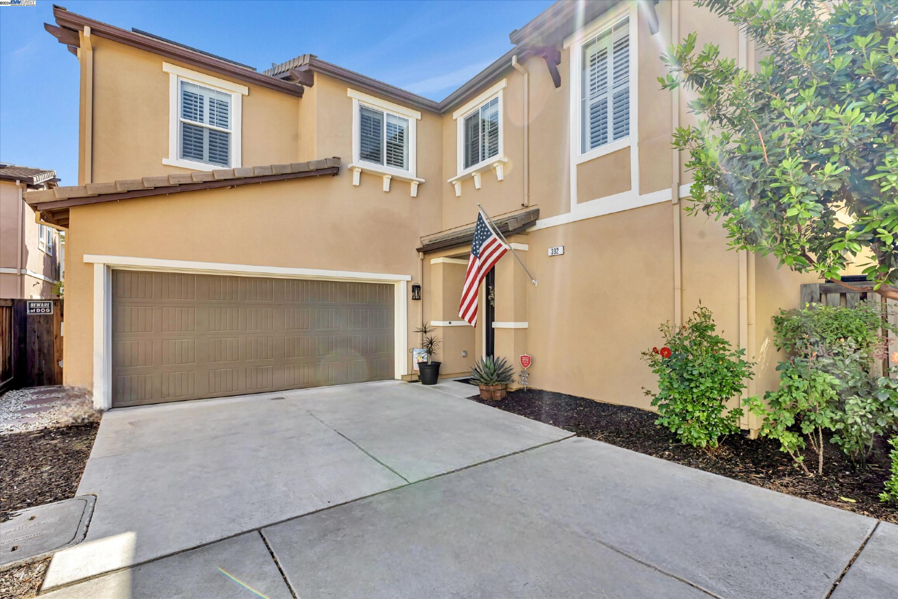 a front view of a house with a garage