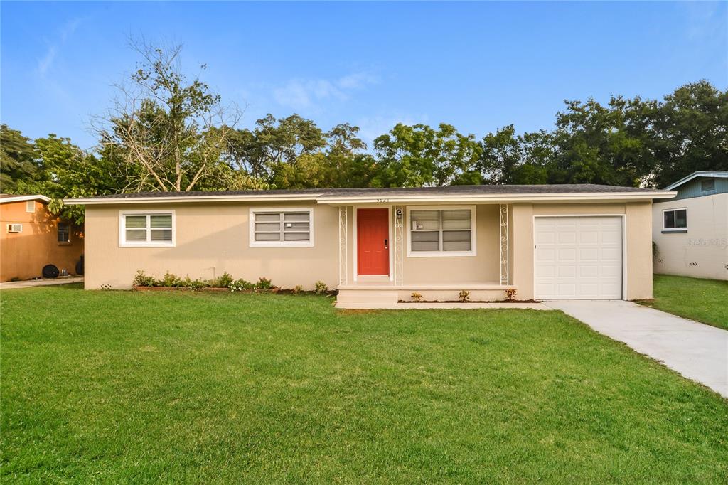 front view of a house with a yard