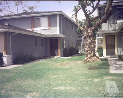 a view of a house with a yard and garage