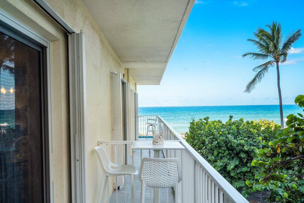 a view of balcony with furniture