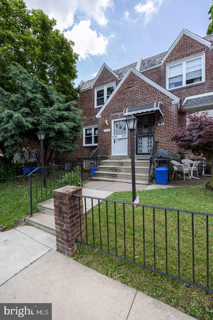 front view of a house with a yard