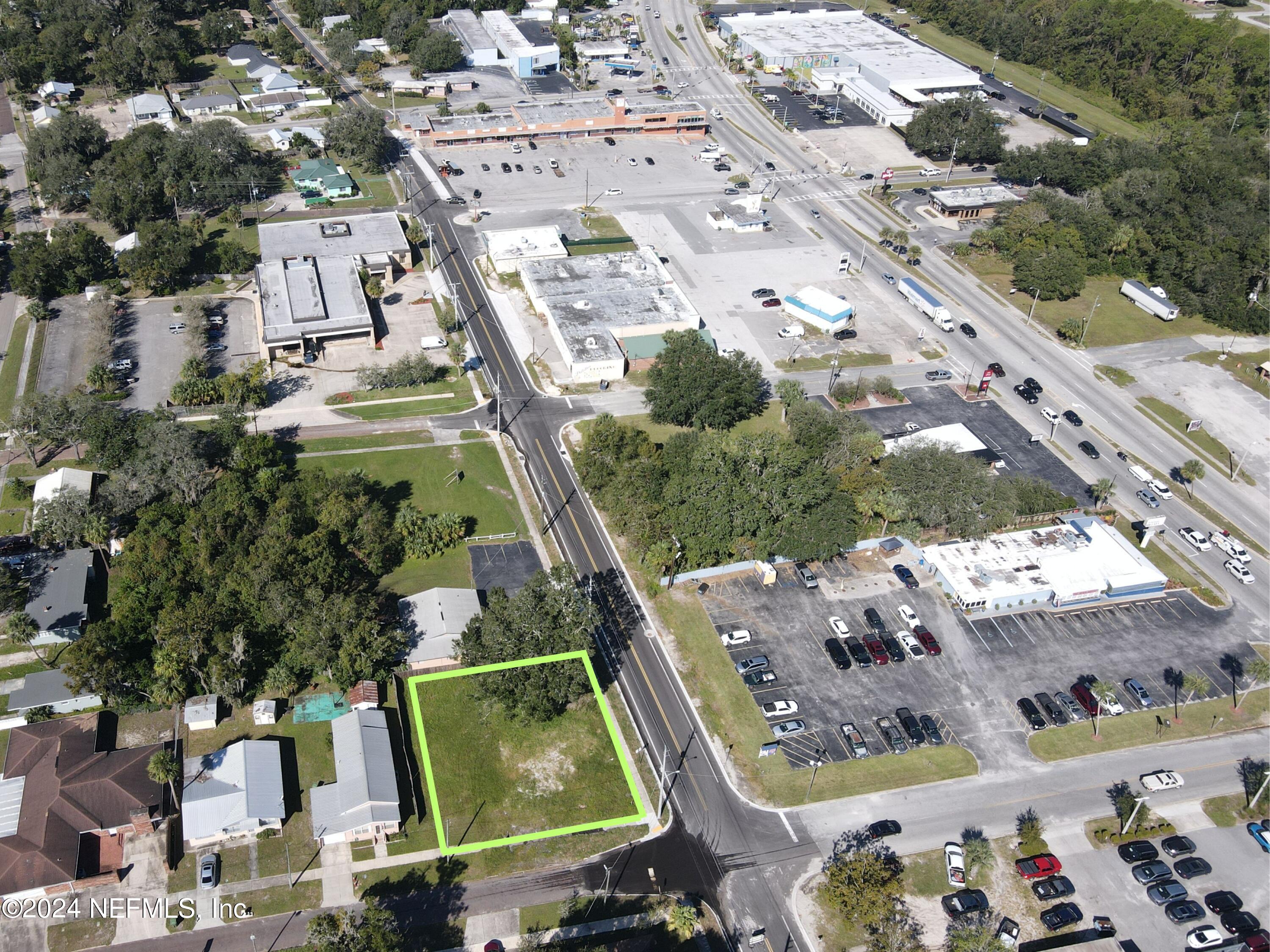 an aerial view of a residential houses with outdoor space