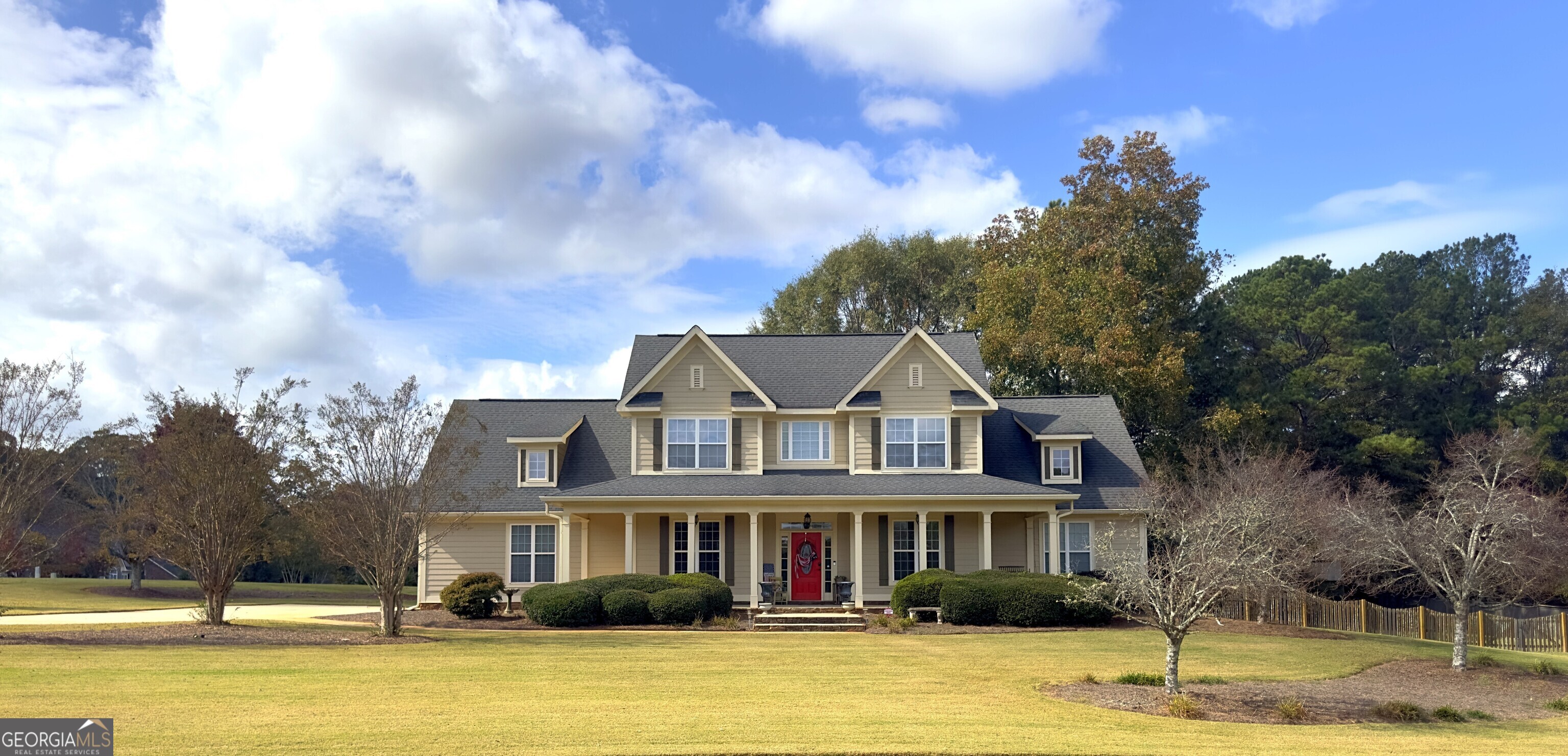 a front view of a house with a swimming pool