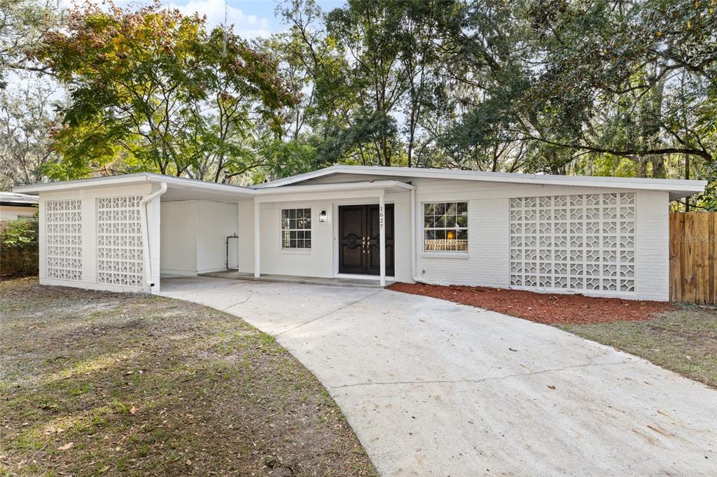 a front view of a house with a garage