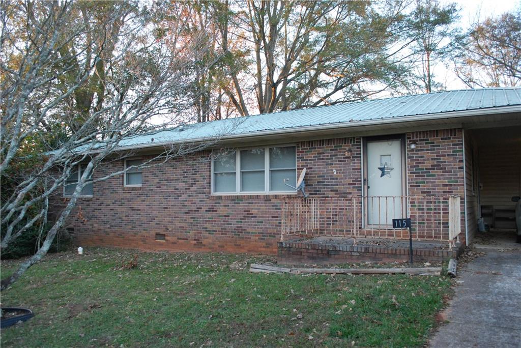 a view of house with backyard