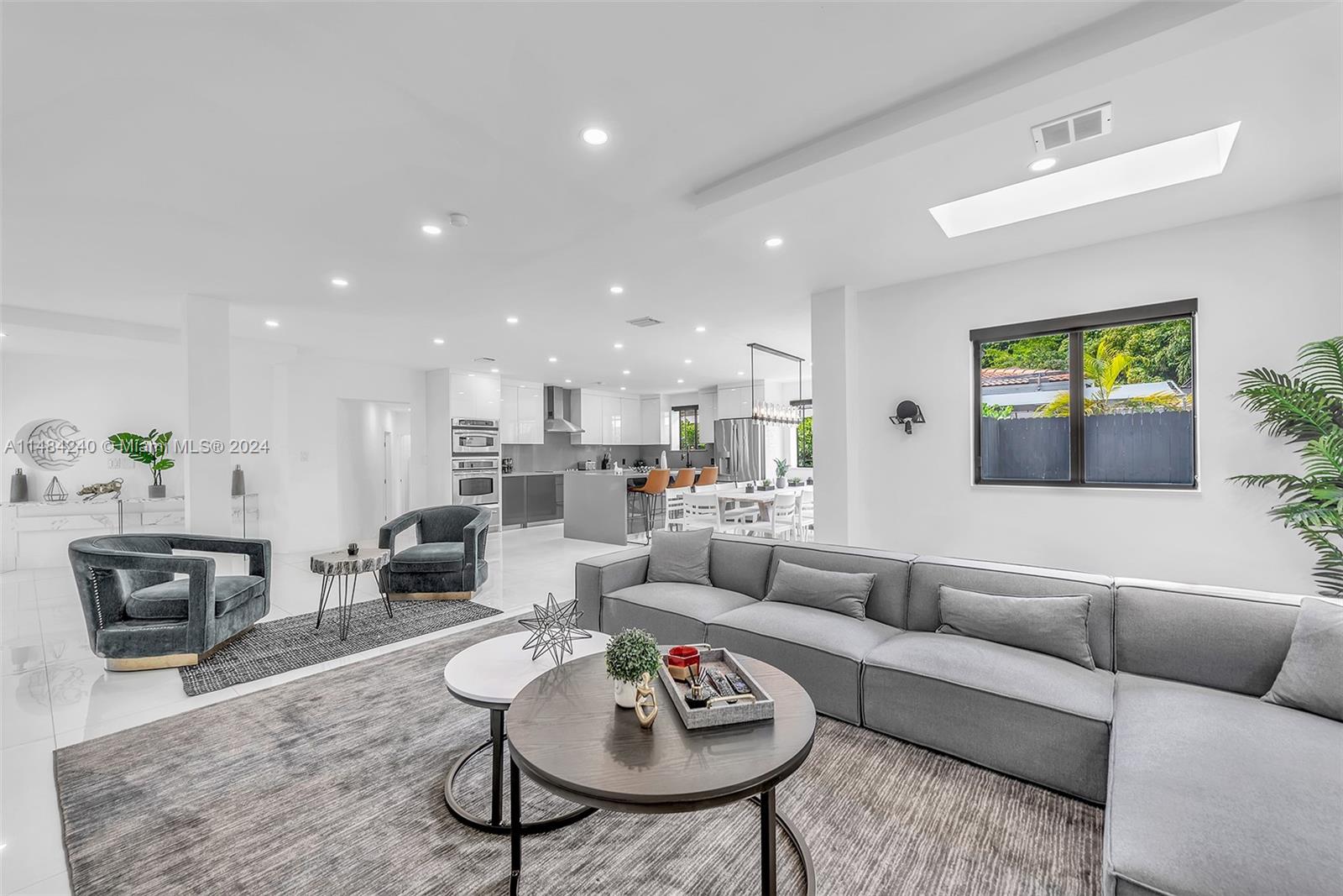 a living room with furniture and a rug