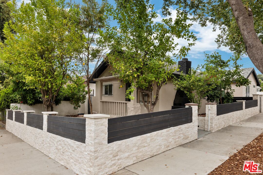 a view of a house with a tree