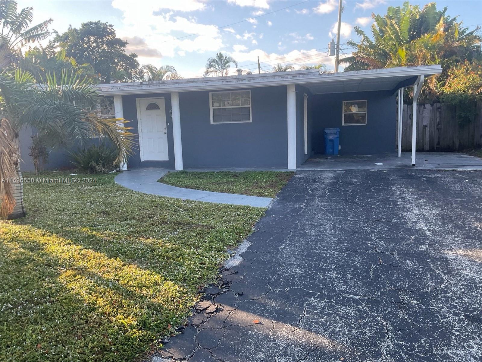 a view of a house with a yard and garage