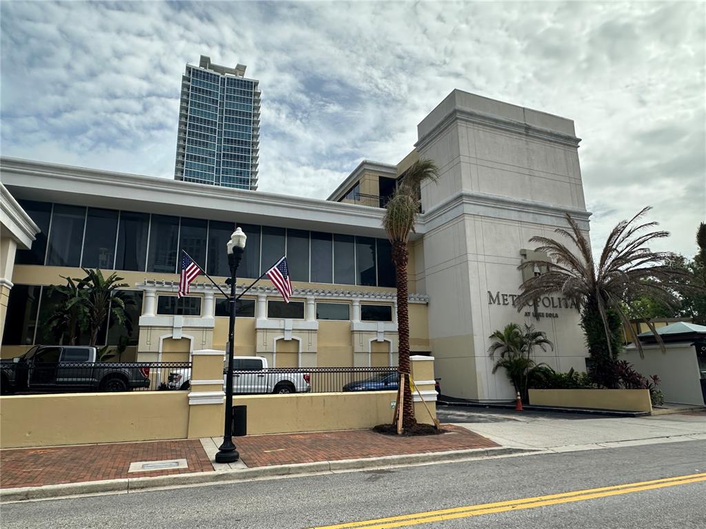 a front view of a building with glass windows and ceiling