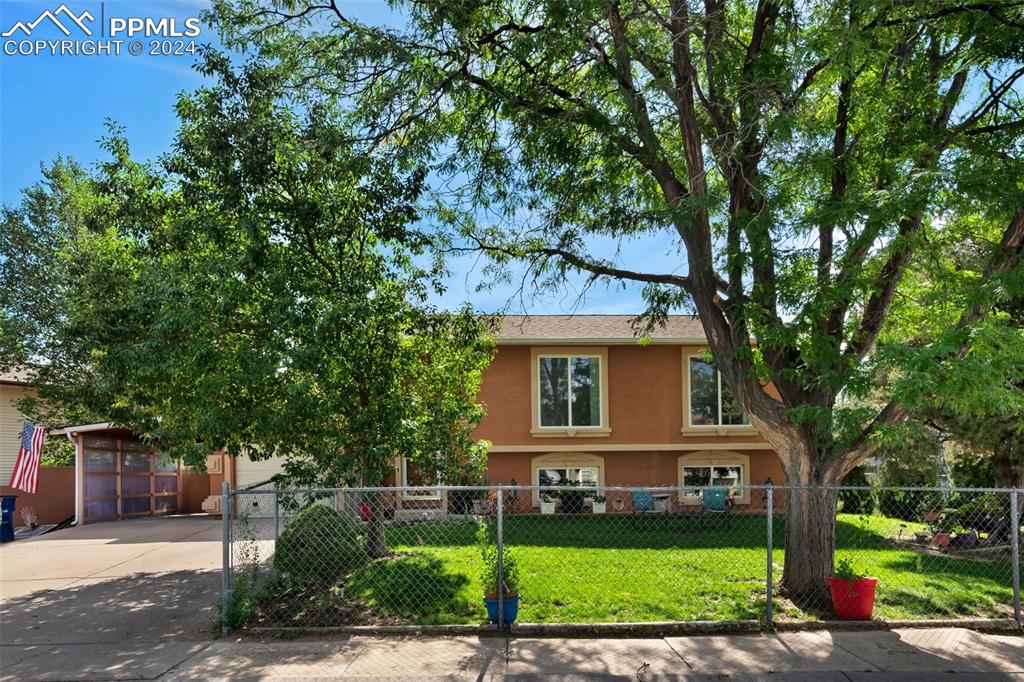 front view of a house with a yard