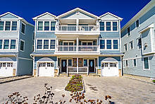 a front view of a building with a lot of windows