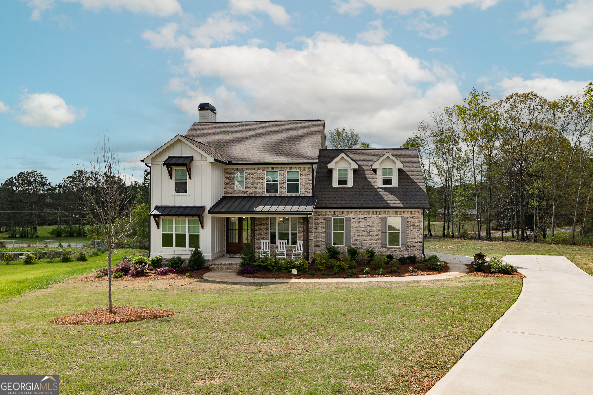 a front view of a house with a yard