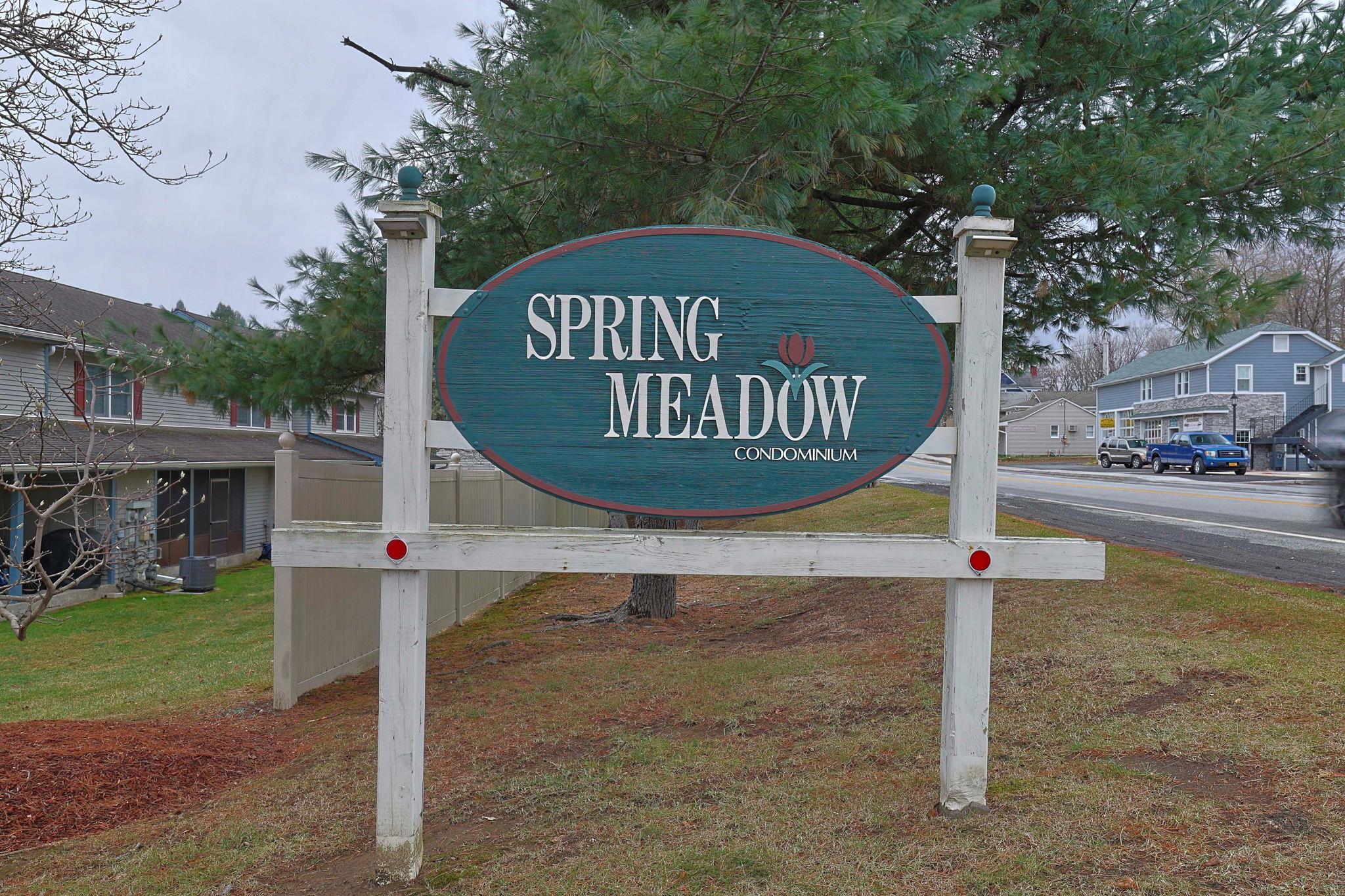 a front view of a house with sign board