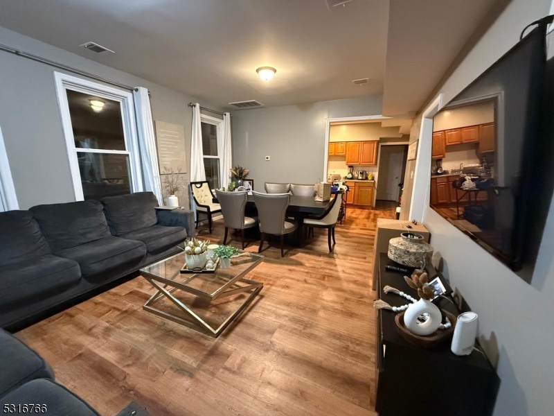 a living room with furniture rug and window