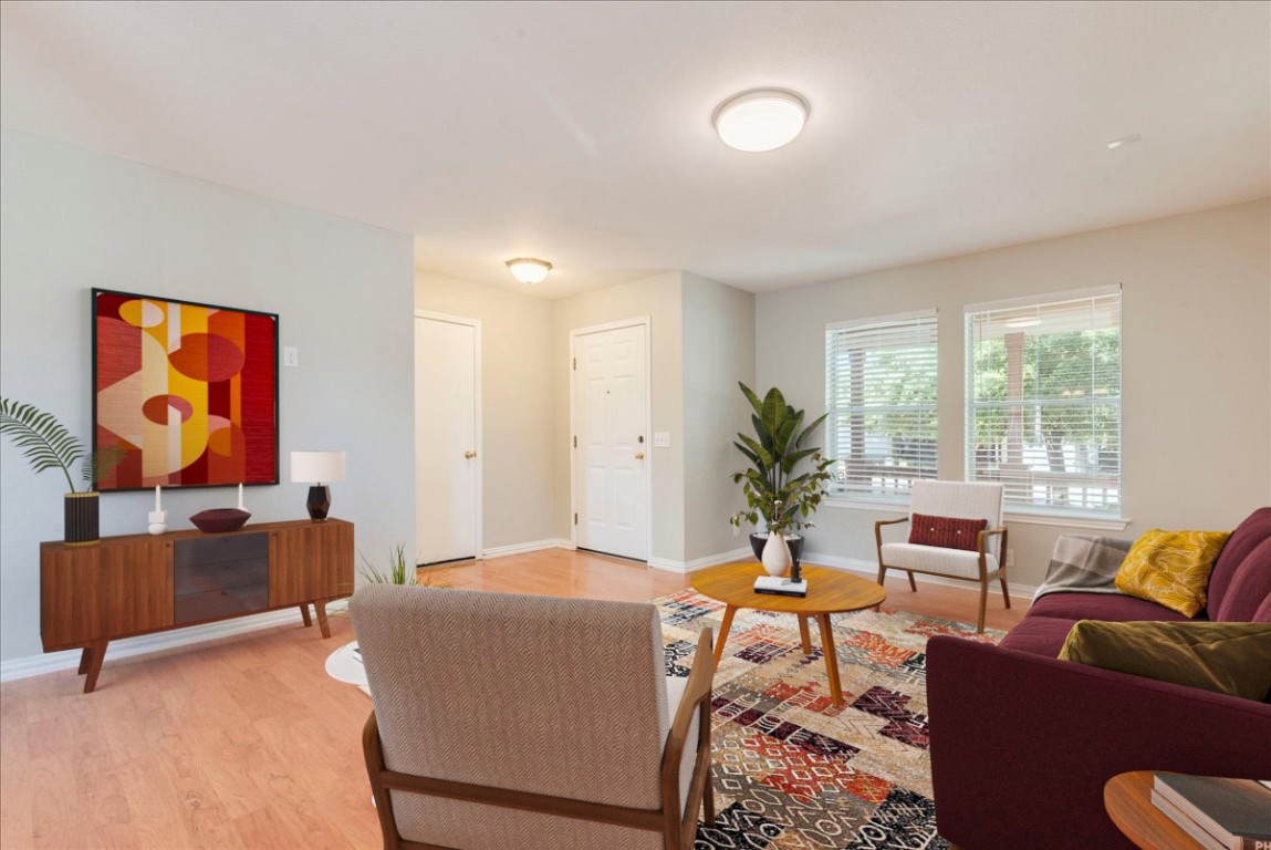 a living room with furniture and a large window