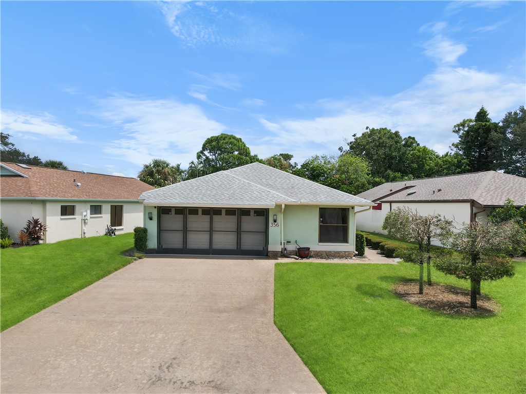 front view of a house with a yard