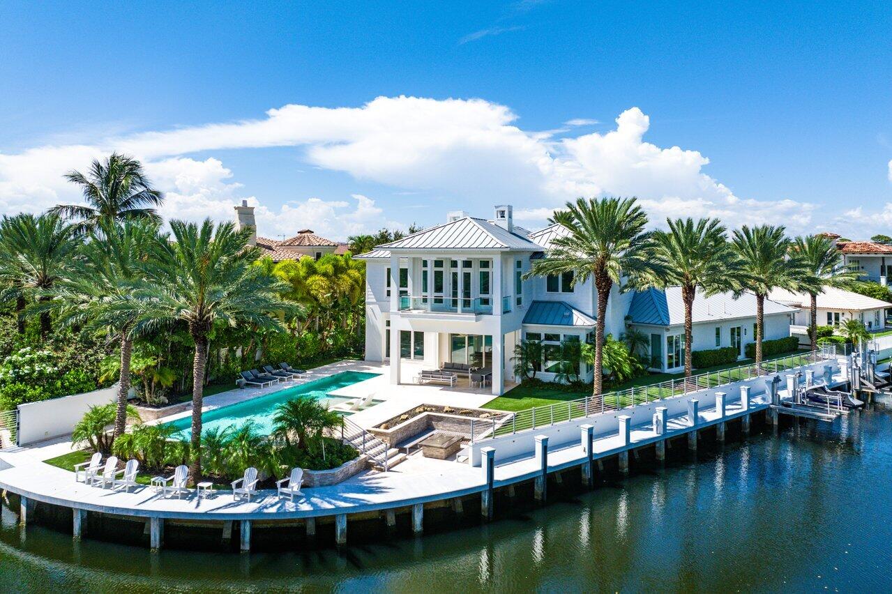 a view of residential house with swimming pool and lake view