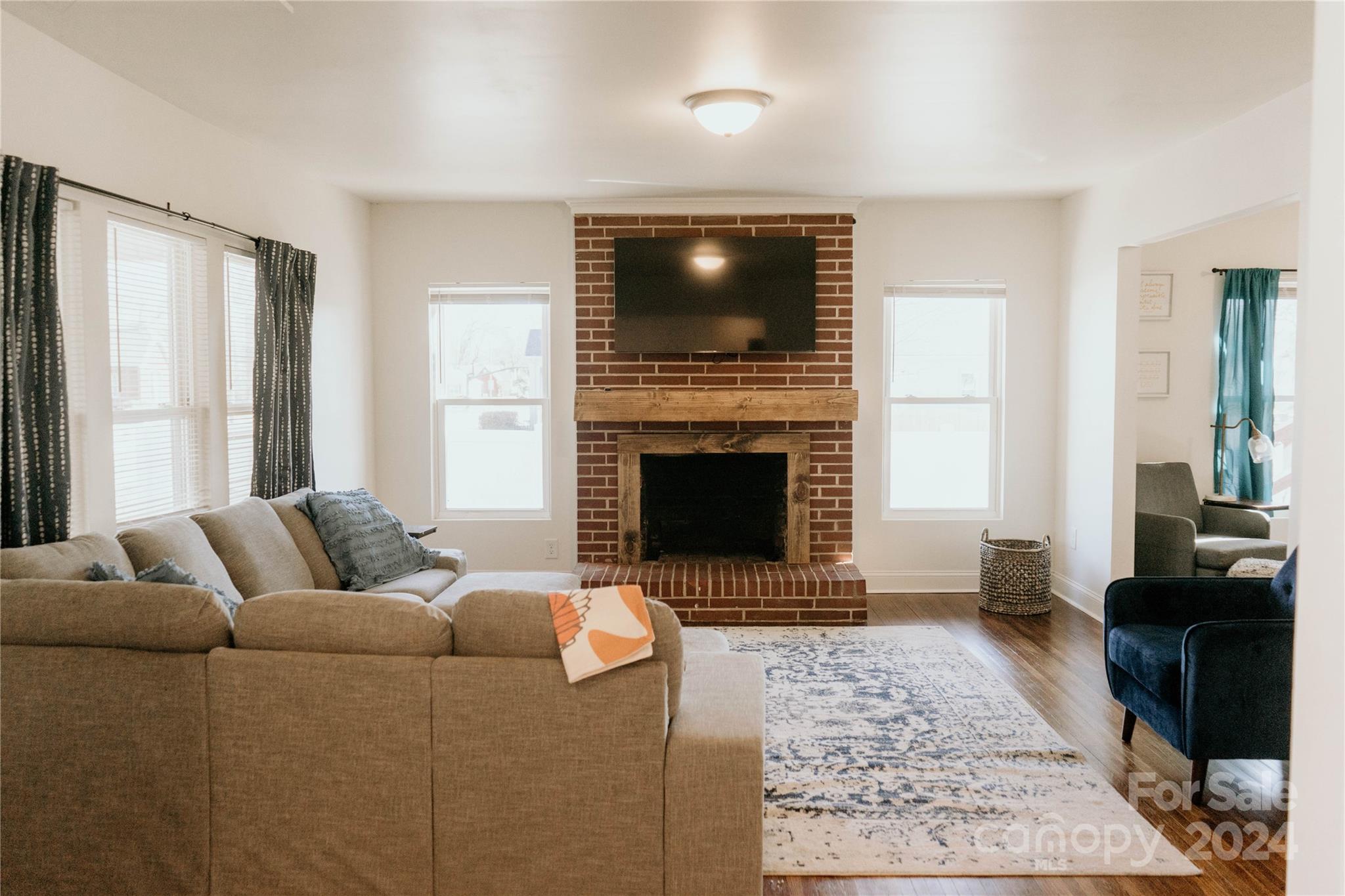 a living room with furniture and a flat screen tv