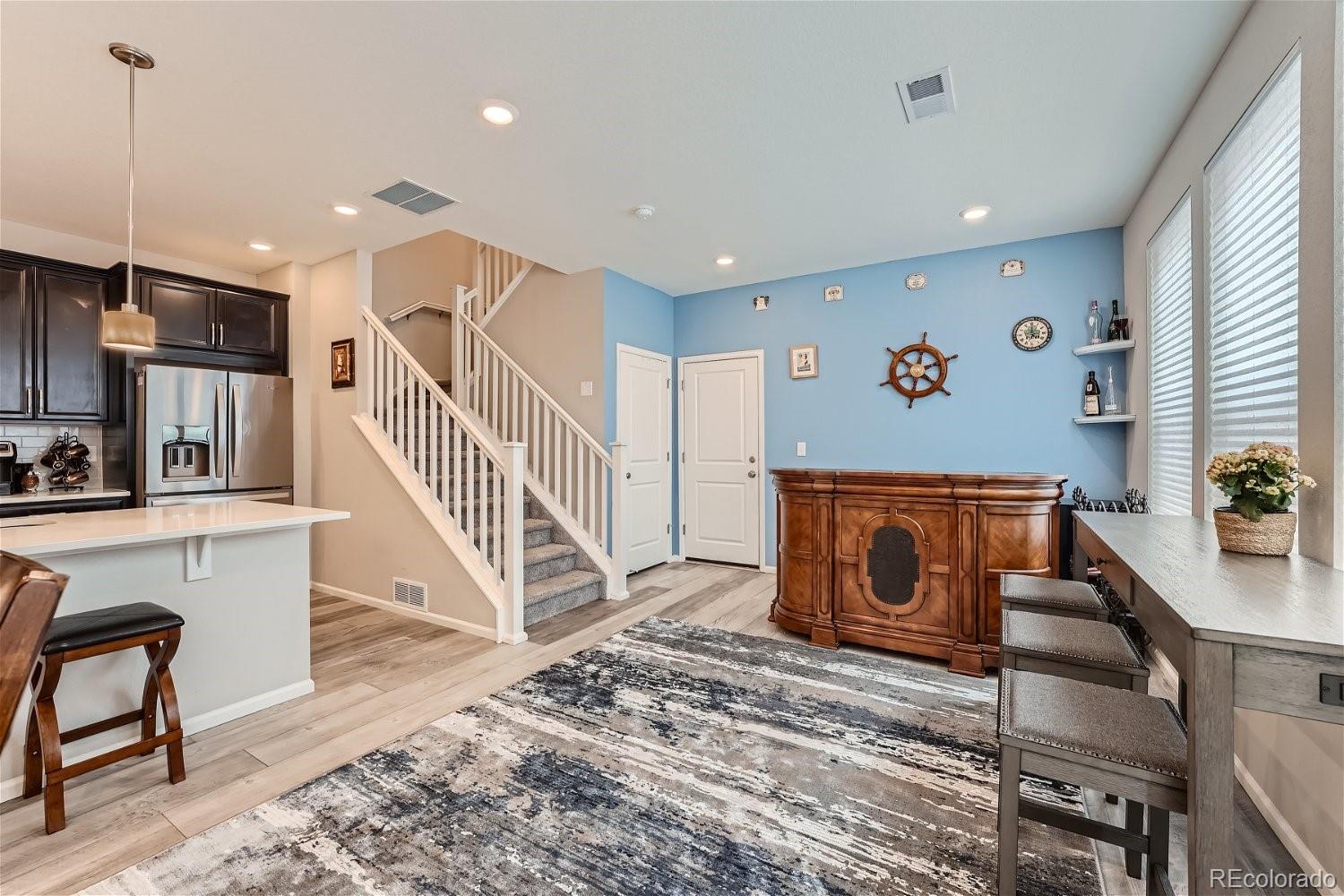 a view of kitchen with furniture and wooden floor