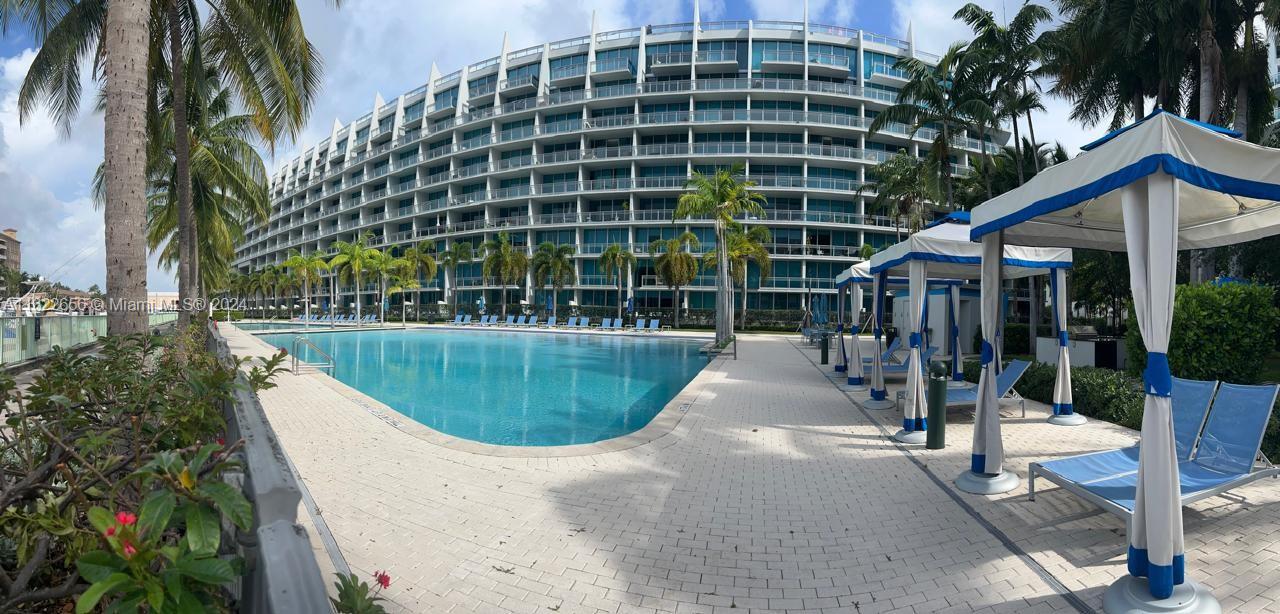 a view of a swimming pool with a patio