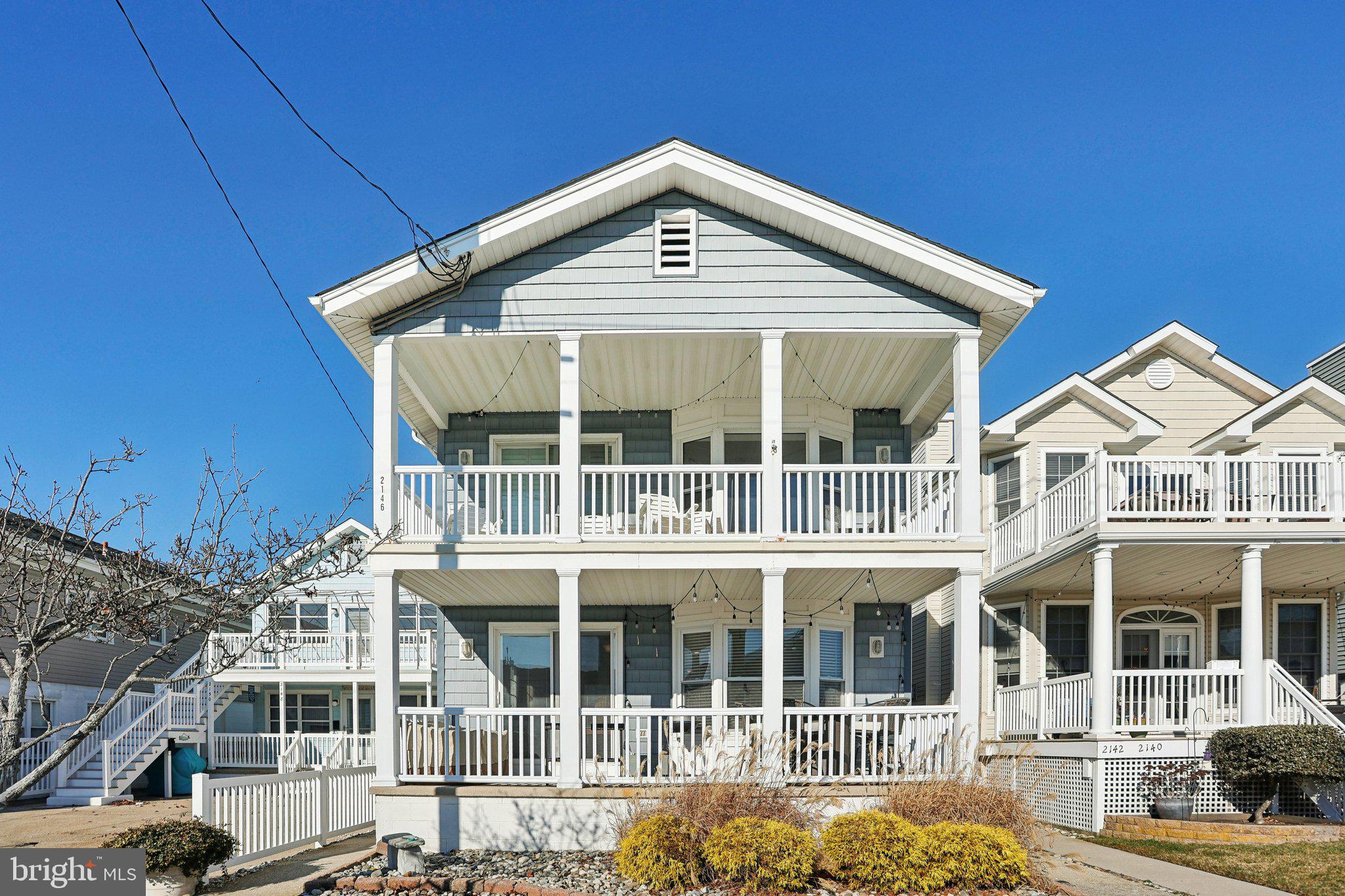 a front of a house with a large windows