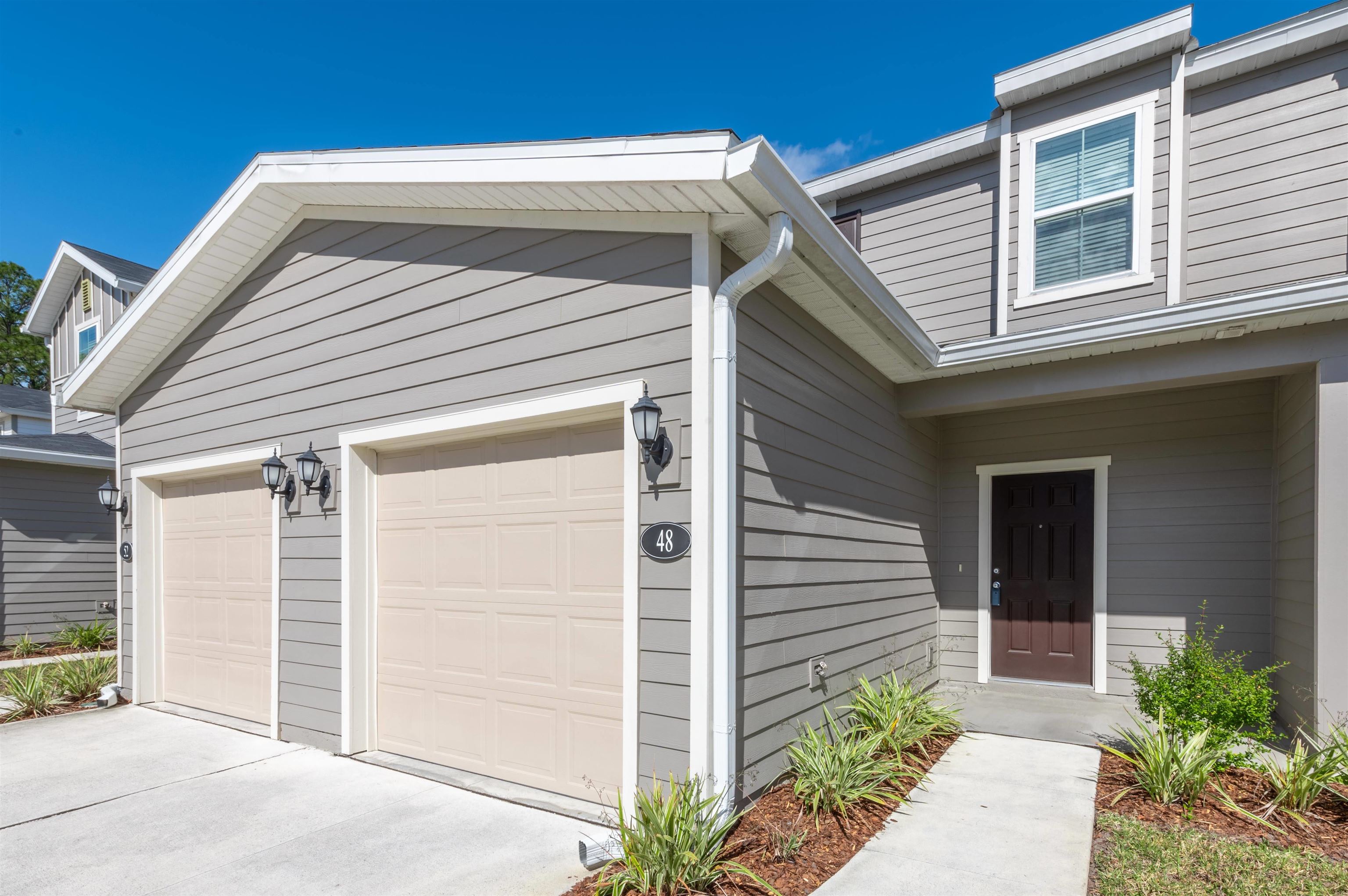 a front view of a house with a garage