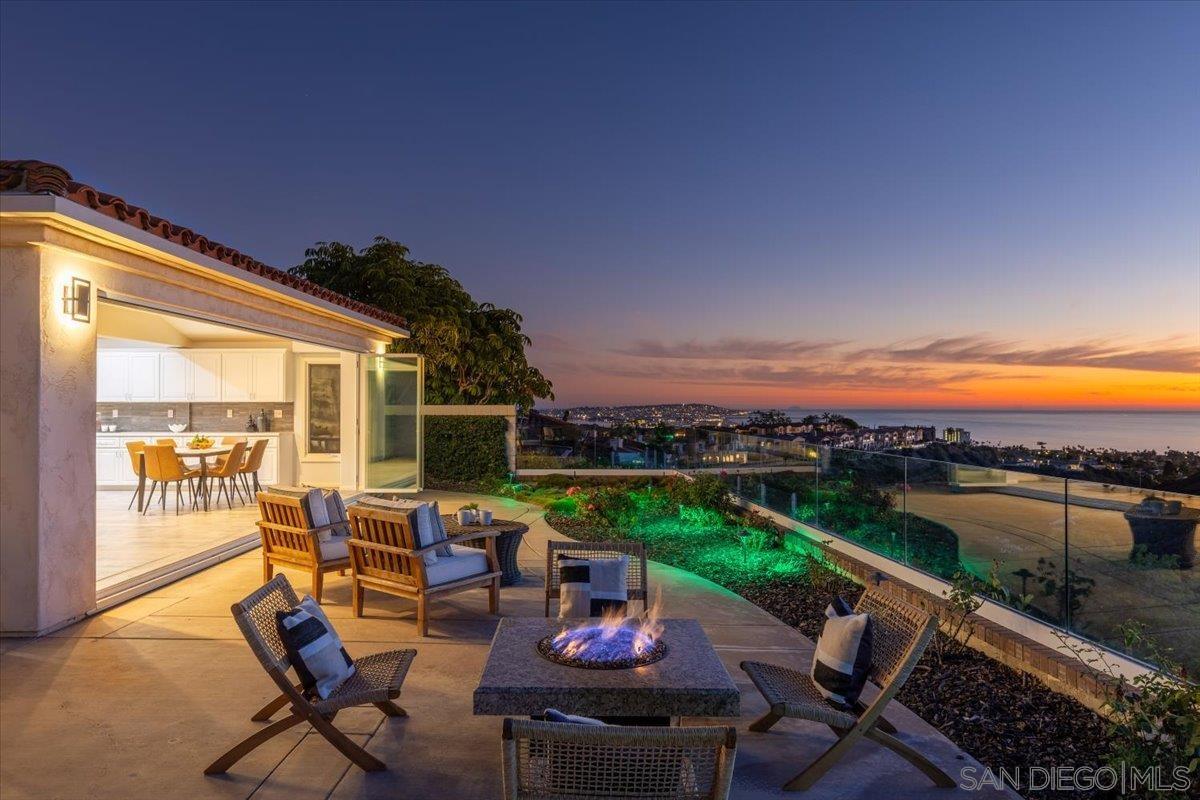 a view of a patio with chairs and a table