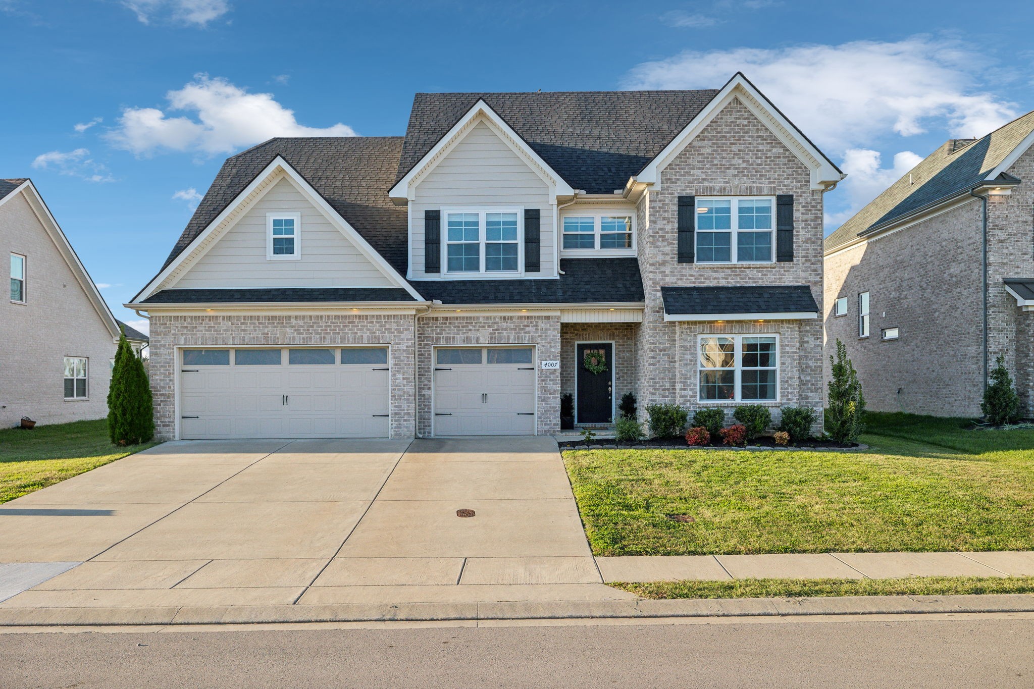 This partial brick home features a large paved driveway and a 3-car attached garage! 4007 Runyan Cv  Murfreesboro, TN 37127