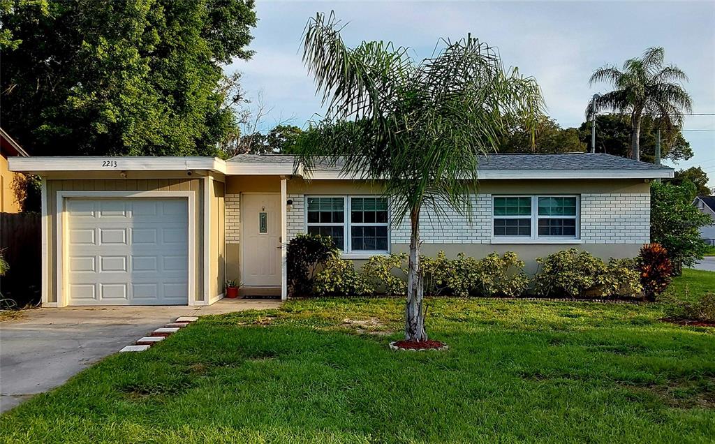 front view of a house with a yard