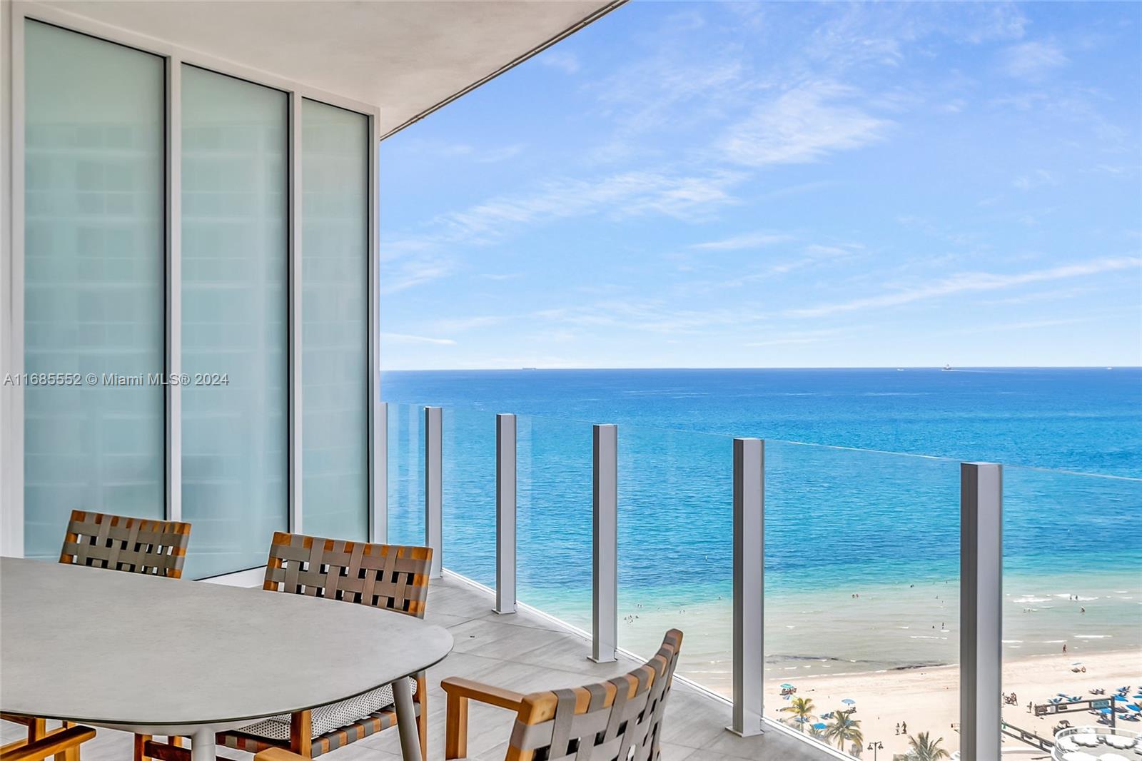 a balcony with table and chairs