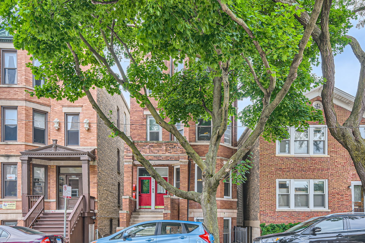 a front view of a multi story residential apartment buildings