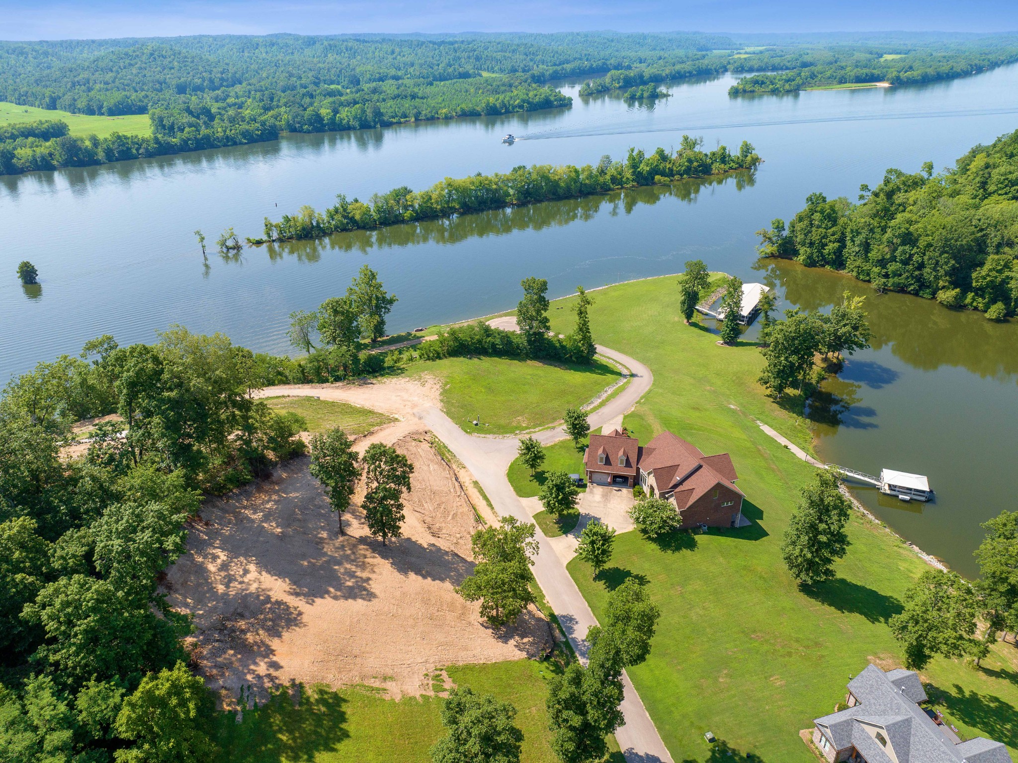 an aerial view of a house with a lake view