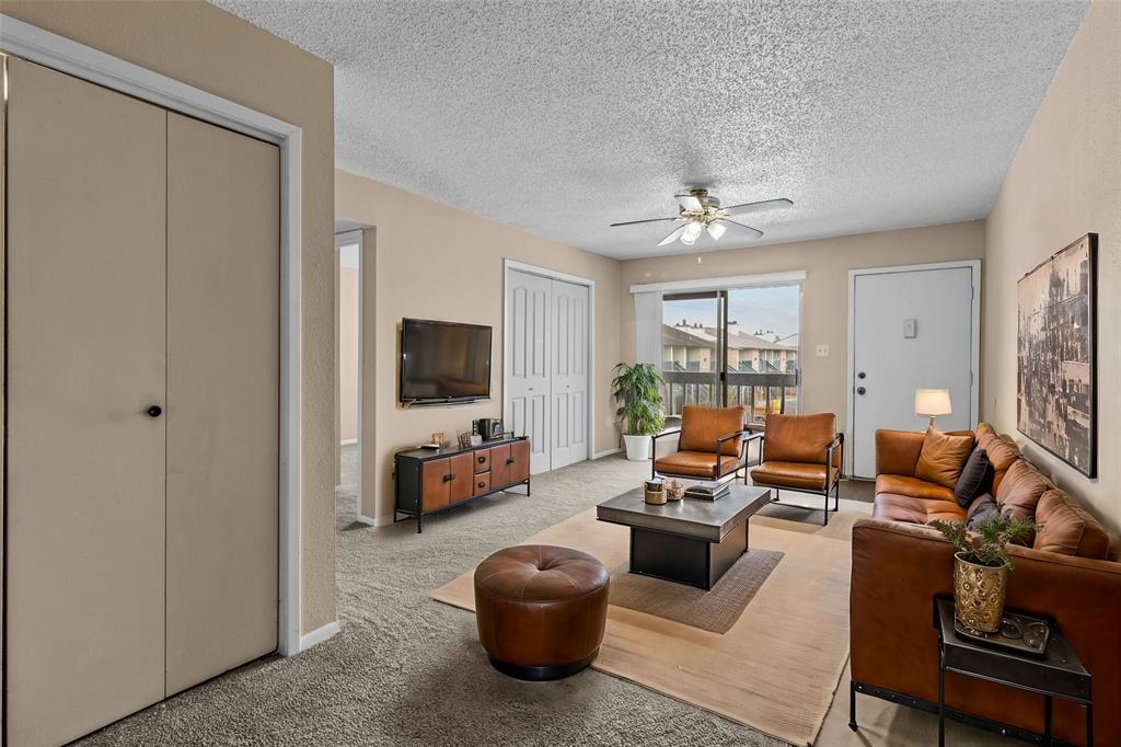 Virtually staged living room, the white double doors on the left open to the flex room which could be study or second bedroom, it has 2 closets.