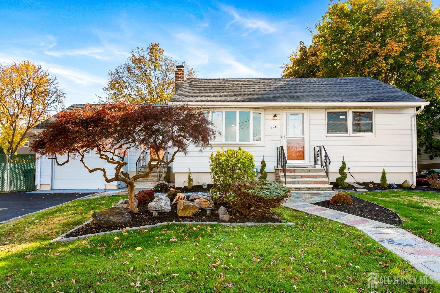 a view of a house with a backyard