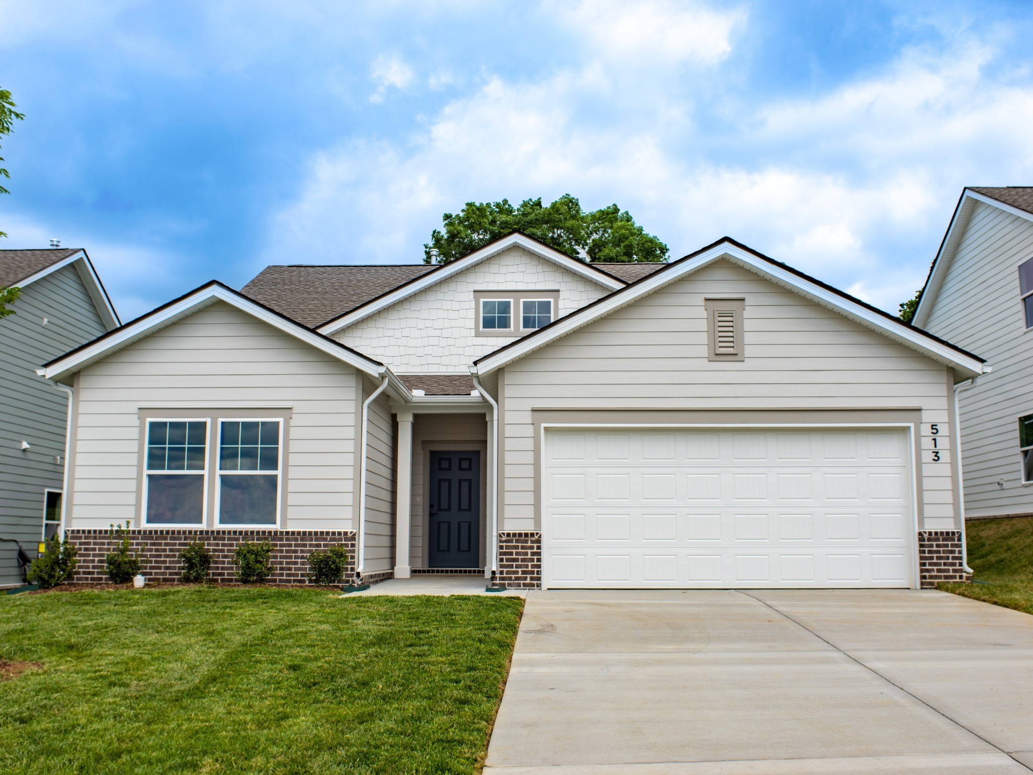 a front view of a house with a yard