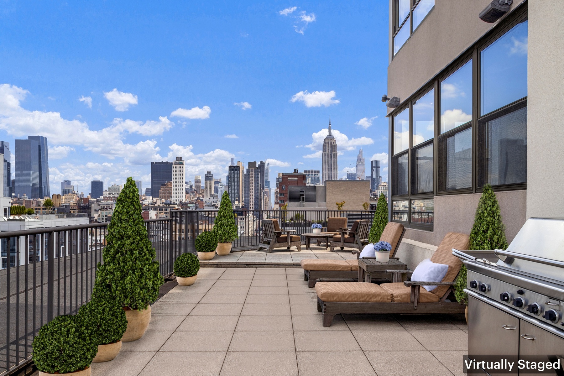 a view of roof deck with patio